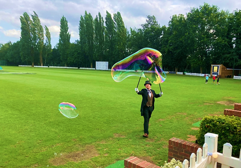 Bubble entertainer performing on the cricket ground